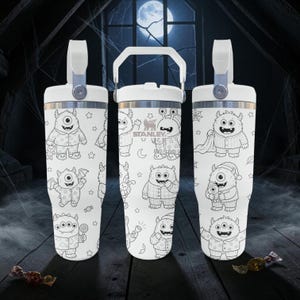 May include: Three white Stanley tumblers with a repeating black line art pattern of various monsters in pajamas, stars, and moons. Each tumbler features a white lid with a handle, and the center tumbler displays the Stanley brand logo clearly.