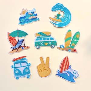 May include: A selection of embroidered patches with a summer beach theme. Designs include a surfer on a wave, a beach scene with an umbrella and chair, a peace sign, surfboards, and a van with surfboards on top. The patches feature bright colours.