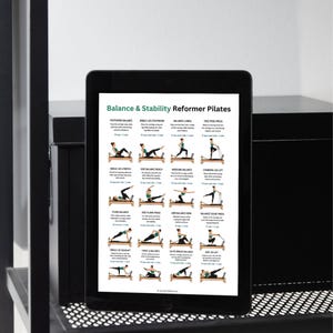 May include: A black tablet displaying a Balance & Stability Reformer Pilates guide. The screen features twenty illustrated exercise diagrams with text instructions, showing various poses performed on a wooden reformer machine with black straps.