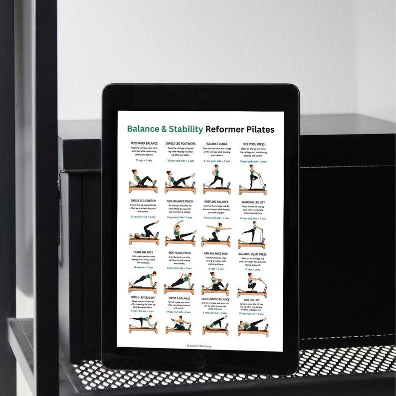 May include: A black tablet displaying a Balance & Stability Reformer Pilates guide. The screen features twenty illustrated exercise diagrams with text instructions, showing various poses performed on a wooden reformer machine with black straps.