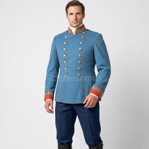 May include: A light blue military-style jacket with gold buttons and red and gold trim. The jacket has a high collar and is paired with navy blue pants. The text "THE ROYAL OUTFITS" is visible on the jacket.