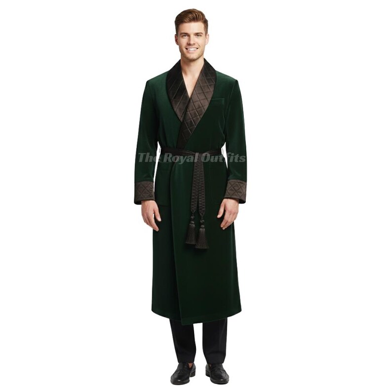 Front view of long green velvet smoking jacket with button closure and black quilted lapels, displaying classic Victorian and Edwardian evening wear design with premium velvet fabric finish