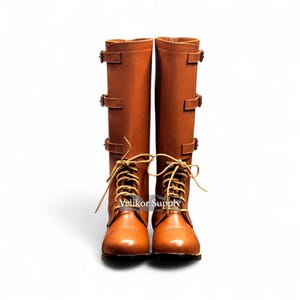 May include: A pair of tall, brown leather boots with multiple buckles and laces. The boots have a classic design with a round toe and are suitable for various outdoor activities. The boots are approximately 16 inches tall.