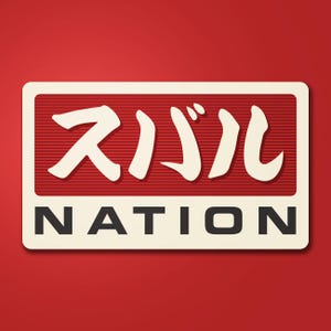 May include: A rectangular logo with Japanese characters and the word "NATION" in a bold, sans-serif font. The logo is set against a red background. The Japanese characters are in white, and the word "NATION" is in black.