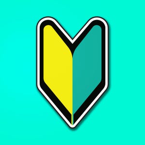 May include: A beginner driver sticker, featuring a stylized V-shape with yellow and teal sections, outlined in black and white, against a teal background. This sticker is commonly used in Japan to identify new drivers.