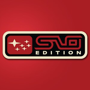 May include: A rectangular sticker with a red background featuring a black and red logo. The logo includes a red square with white stars, the letters "S" and "T" in red, and the word "EDITION" in white.