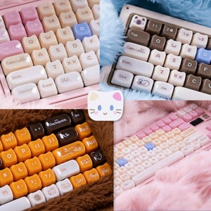 May include: A collage of four images showcasing custom mechanical keyboards with various keycap designs. The keyboards feature pastel colors, including pink, white, and blue. Keycaps have unique designs, including cat-themed and other decorative elements. The keyboards are on a fluffy surface.