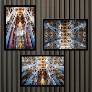 May include: Three framed prints displaying architectural interiors. The images depict the detailed ceilings and columns of a cathedral, highlighting the use of light and shadow. The colour scheme features blues, golds, and browns, producing a sense of depth and grandeur.