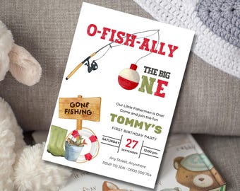 May include: A white invitation card with a fishing theme. The card features the text "O-FISH-ALLY THE BIG ONE" in red and green. It includes a fishing rod illustration and details for Tommy's first birthday party, including the date, time, and RSVP information.