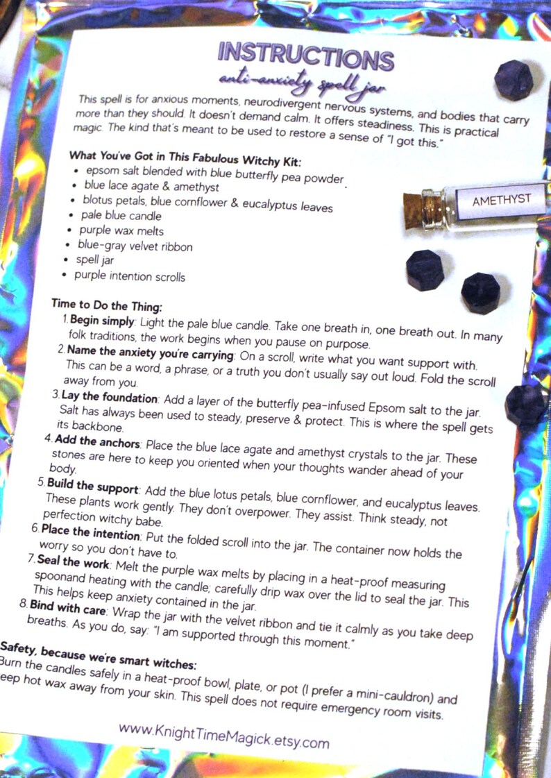 May include: An anti-anxiety spell jar kit with instructions. The kit includes a spell jar, amethyst crystals, blue lace agate, a pale blue candle, and other ingredients. The instructions are printed on a white paper with a holographic background.