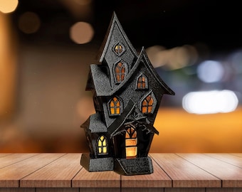 Scary haunted castle in black - decorative haunted house for Halloween and parties