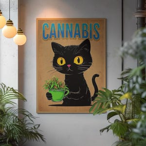 May include: A framed poster featuring a black cat holding a green teacup filled with cannabis buds. The word "CANNABIS" is written in blue letters above the cat. The poster has a brown background and is surrounded by a wooden frame.