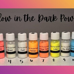 May include: Twelve small clear plastic bottles filled with various colored glow in the dark powder, labeled with names like Dark Purple, Rose Red, Pink, Green, Cyan, Yellow, Orange Yellow, Lime, Sky Blue, Dark Blue, Light Blue, and Grass Green.
