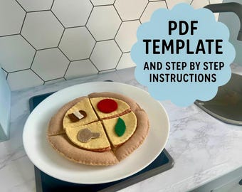 May include: A felt pizza toy with four slices, each topped with different felt ingredients like a mushroom, tomato, and green pepper, presented on a white plate. The image includes text that says "PDF TEMPLATE AND STEP BY STEP INSTRUCTIONS".
