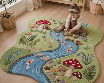 May include: An irregularly shaped green area rug featuring a winding blue river, koi fish, mushrooms, ferns, and flowers. The rug has a textured surface with raised elements depicting a nature scene with stones and a small stone well illustration.