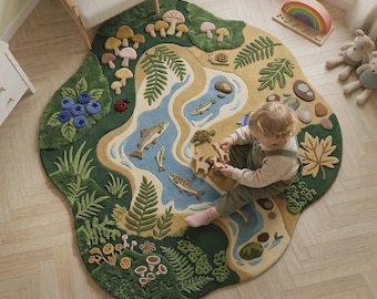 May include: An irregular, nature-themed area rug featuring a textured landscape with a winding blue river, green forest patches, mushrooms, ferns, blueberries, and various wildlife motifs including fish, a turtle, a snail, and a ladybug.