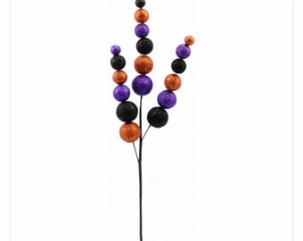 May include: A black stem with purple, orange, and black glitter balls attached. The stem is about 12 inches long. Halloween decoration.