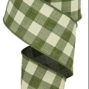 May include: A roll of green and white buffalo plaid ribbon. The ribbon is 2.5 inches wide and has a wired edge.