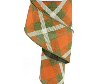 May include: A roll of 2.5 inch wide plaid ribbon with a green, orange, and white checkered pattern.
