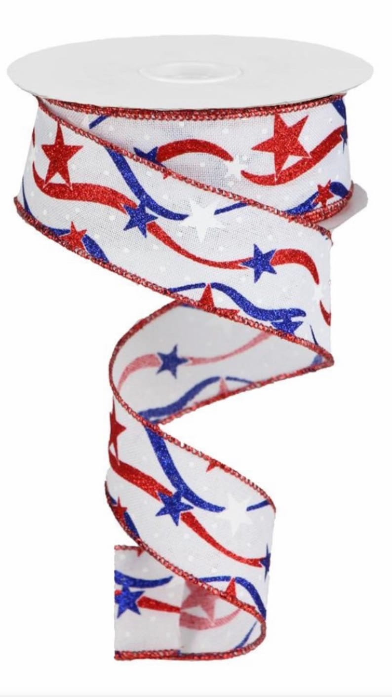 May include: White ribbon with red and blue stars and wavy lines. The ribbon has a white background with red and blue glitter stars and wavy lines. The ribbon is 2.5 inches wide.