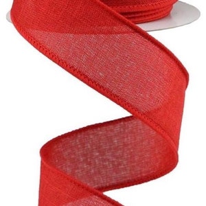 May include: A roll of red burlap ribbon with a wired edge. The ribbon is 2.5 inches wide and has a natural, rustic look.