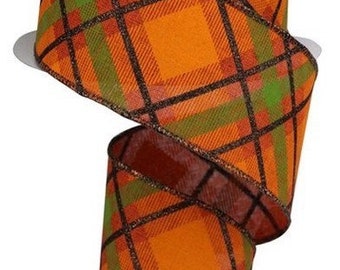 May include: Orange, green, and brown plaid ribbon with a black and gold glitter accent. The ribbon is 2.5 inches wide and is perfect for crafting and decorating.