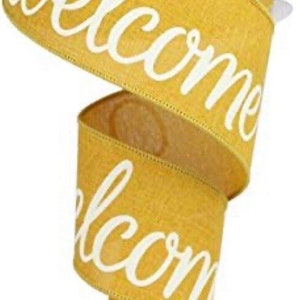 May include: A roll of yellow ribbon with white cursive lettering that says "Welcome".