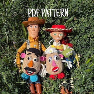 May include: A collection of Toy Story character figures including a plastic cowboy, a plastic cowgirl, a small green alien, and two crocheted potato-shaped dolls. The text PDF PATTERN is visible at the top of the image above the figures.