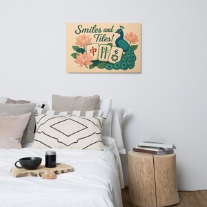 May include: A rectangular wall art print featuring a peacock, lotus flowers, and Mahjong tiles. The text "Smiles and Tiles!" is displayed in a decorative font. The peacock is teal and the background is beige.