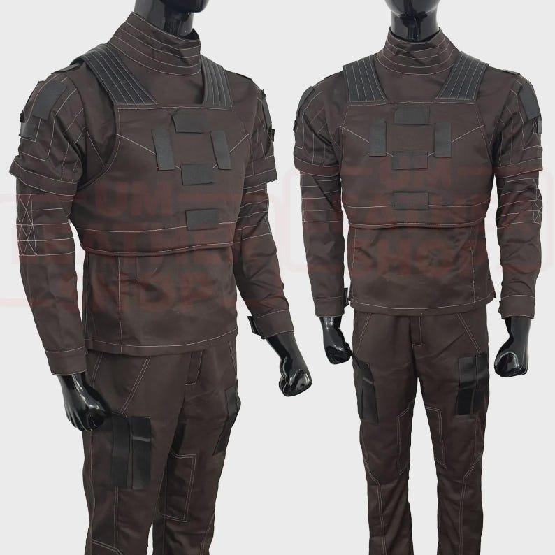May include: Two brown tactical outfits displayed on mannequins. Each outfit includes a long-sleeved shirt with a high collar, a chest rig with black accents, and matching pants with pockets. The outfits are designed with a utilitarian aesthetic.