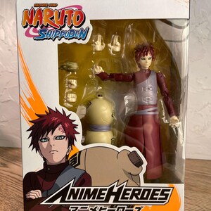 May include: A boxed Anime Heroes Gaara action figure from Naruto Shippuden. The figure is in a clear plastic display case with extra hands and a gourd accessory. The box features the Naruto Shippuden logo and the Anime Heroes logo.