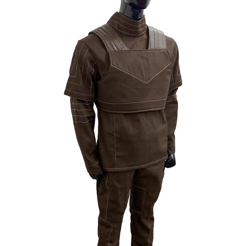 May include: A white ceramic mug with a black handle and the text "But First, Coffee" in a black, bold font. The mug is on a wooden surface. The mug is 10 cm tall.