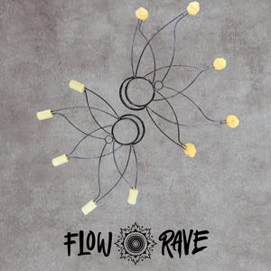 May include: Two black metal flower-shaped flow props with circular finger rings and pale yellow wicks at the end of each petal-like wire arm. The text FLOW RAVE is printed in black below the props with a sun-like spiral icon in the centre.