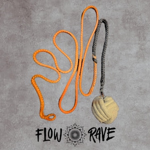 May include: A flow toy featuring a long, bright orange braided cord connected to a grey braided section that leads to a beige, spherical monkey fist knot. The text FLOW RAVE with a central spiral icon is printed in black below the object.