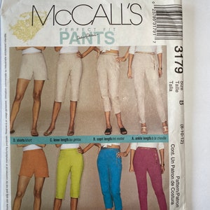 May include: McCall's Perfect Fit Pants sewing pattern for sizes 8-10-12. The pattern includes five different pant styles: shorts, knee length, capri length, ankle length, and a pattern for the waistband. The pattern is printed on white paper with black text and illustrations.