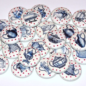 May include: A collection of 20 round white buttons with red hearts printed on them. Each button features a different vintage illustration of a teapot or coffee pot in blue and white.