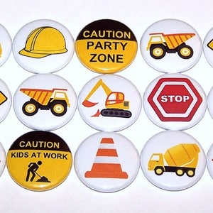 May include: A set of fifteen circular pin-back buttons featuring construction-themed graphics. Designs include yellow cement mixers, dump trucks, excavators, hard hats, traffic cones, and signs with text like CAUTION PARTY ZONE, LOADS OF FUN, DIG IN THE FUN, CAUTION KIDS AT WORK, STOP, and DETOUR.