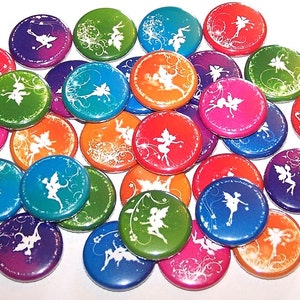 May include: A collection of colorful round buttons with a white silhouette of a fairy on each button. The buttons have a variety of colors including red, orange, yellow, green, blue, purple, and pink.