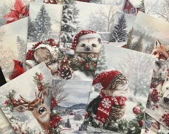 May include: A collection of rectangular greeting cards featuring winter scenes with a hedgehog in a Santa hat, a cat in a red scarf, a deer, a polar bear, a cardinal, and snowy landscapes with pine trees, red berries, and poinsettia flowers.