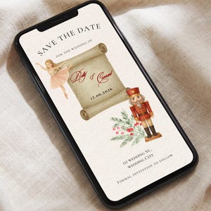 Könnte beinhalten: Ein Smartphone zeigt eine Hochzeitseinladung mit dem Text "SAVE THE DATE" und "Bay & Conrad" mit dem Datum 17.06.2026. Das Design umfasst eine Ballerina, einen Nussknacker und florale Elemente.