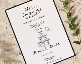 Peut inclure: Une invitation de fiançailles en noir et blanc avec le texte "Shhh... Pouvez-vous garder un secret ? Il va proposer !" et les noms Olivia & Kevin. L'invitation comprend un dessin d'un présentoir à desserts à étages et deux anneaux.