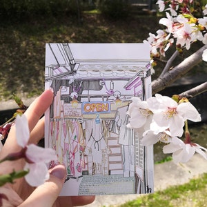 A painted traditional Japanese scene: an old kimono shop in Kyoto printed art card