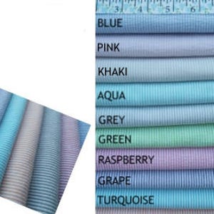 May include: Mini seersucker fabric swatches in various colors, including blue, pink, and green. The fabric is lightweight and 58/60 inches wide, suitable for applique, apparel, and home decor projects. The image also includes a ruler.