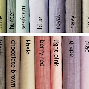 May include: A collection of fabric swatches in various colors and patterns, including lime, hunter, seafoam, blue, royal, navy, grey, black, chocolate brown, khaki, berry red, light pink, grape, and lilac.