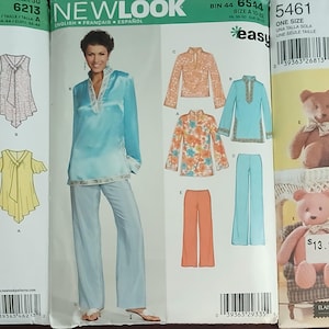 May include: Three sewing pattern envelopes featuring New Look 6213 for sleeveless tops, New Look 6544 for a tunic and pants set, and Simplicity Crafts 5461 for stuffed teddy bears. Each envelope displays illustrations of the finished garments or toys.