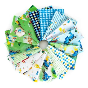 May include: A collection of 12 fabric squares featuring a blue train, a green landscape, and the text "I think I can! I think I can!" in a white font. The fabric squares are arranged in a circle.