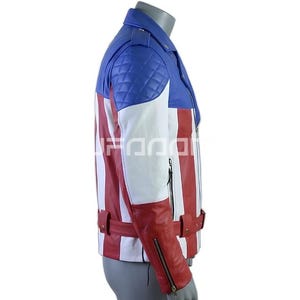 May include: A motorcycle-style jacket featuring a blue quilted shoulder panel, white mid-section, and red lower section with vertical stripes. The jacket includes a collar, a waist belt with a metal buckle, and silver-toned zippered sleeve cuffs.