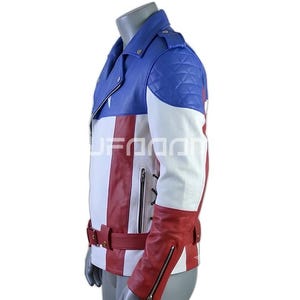 May include: A motorcycle-style jacket featuring a color-blocked design in red, white, and blue. The garment includes a notched lapel, quilted shoulder panels, a waist belt with a buckle, zippered side pockets, and zippered cuffs on the long sleeves.