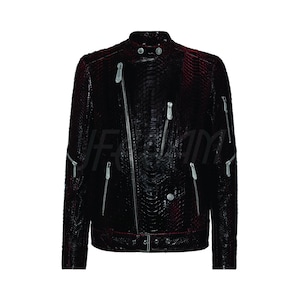 May include: A black leather biker jacket with a textured, snakeskin-like pattern. The jacket features multiple silver zips, a snap-down collar, and a belt at the waist. The jacket is a dark burgundy colour.