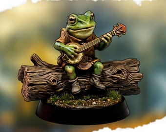 May include: A miniature figurine of a green frog playing a banjo while seated on a brown log. The frog wears a brown tunic and boots. The base is black with small patches of green grass. The text "BANJO FROG MINIATURE" is at the top.